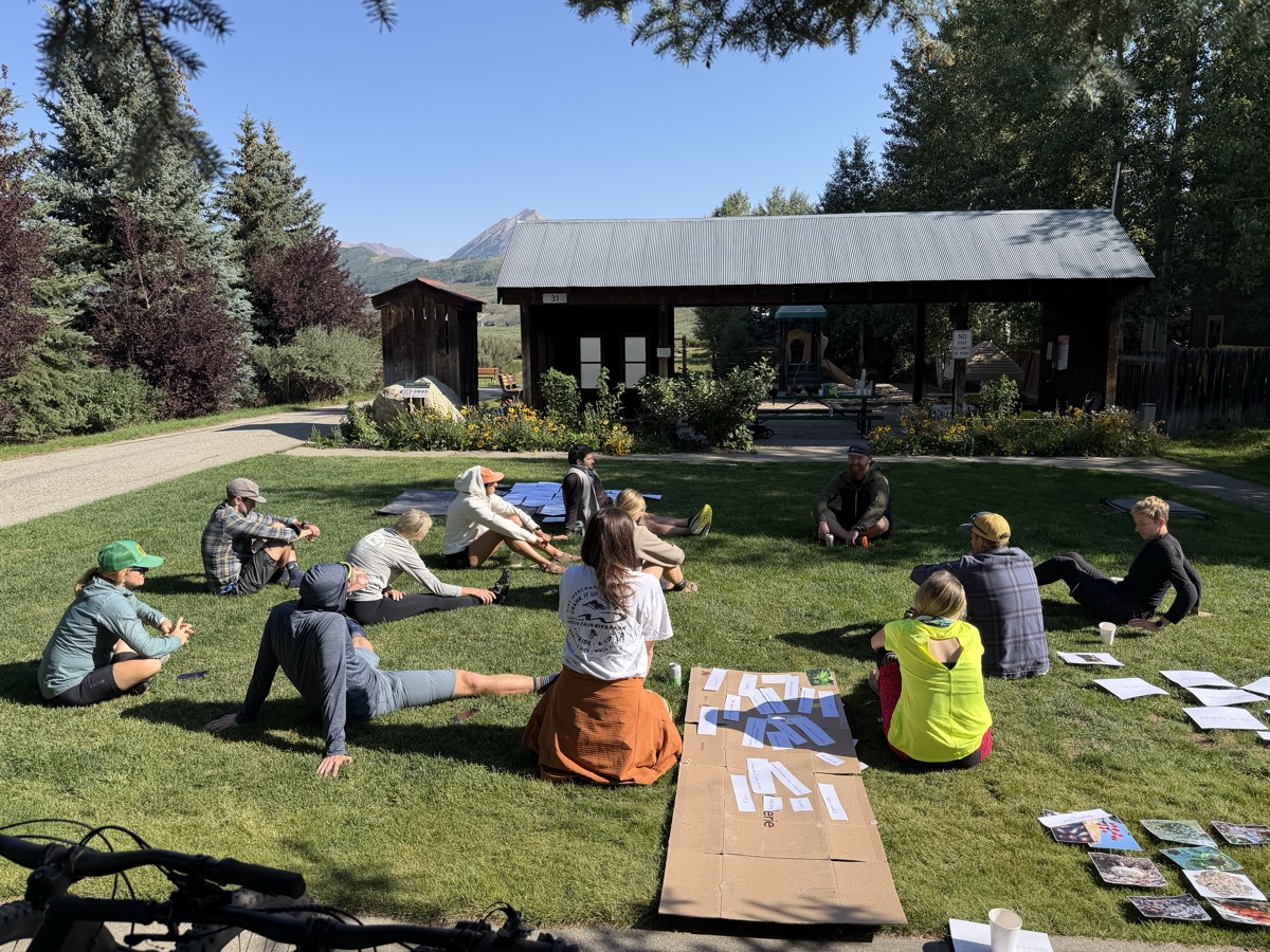 Physicians working through a hands-on wilderness medicine skills session