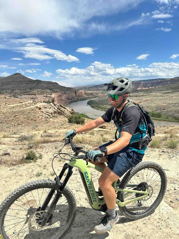 A rider on desert singletrack above the Colorado River outside Moab